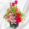 Escape to paradise with this lush and vibrant flower arrangement.  This