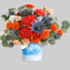 One of a kind! This standout mix of bold orange roses and