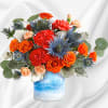 One of a kind! This standout mix of bold orange roses and