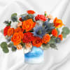 One of a kind! This standout mix of bold orange roses and