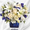 Like gazing into a clear blue sky, this serene arrangement soothes the