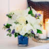 Like gazing into a clear blue sky, this serene arrangement soothes the