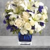 Like gazing into a clear blue sky, this serene arrangement soothes the