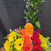 Wind Chime artfully displayed in a copper container accented with roses, alstromaria