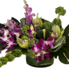 Low cylinder with leaf wrap to include cymbidiums, dendrobium and mokara orchids.