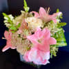 This elegant design is composed of beautiful Pink Asiatic Lilies, White Roses
