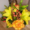 This autumn bouquet is designed with fresh-picked flowers in a charming basket.