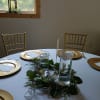 Popular reception table  decor - mixed greens wreath (babies breath and