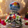 This adorable arrangement includes roses in an assortment of colors, miniature poms