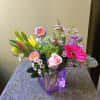 Beautiful one of a kind floral arrangement in a lovely cube vase.
FLOWERS