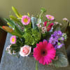 Beautiful one of a kind floral arrangement in a lovely cube vase.
FLOWERS