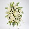 An all white tribute, this funeral spray is pure and tranquil. Featuring