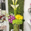 Cylinder clear 6x10 vase accented with stones decorated with hydrangeas, calla lilies