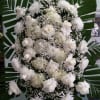 Spray with white roses, white mums, and white hydrangeas.