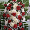 Spray with red roses, white mums, and white hydrangeas.