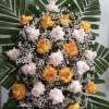 Spray with white and orange roses.