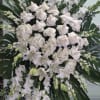 Spray with white roses, hydrangeas, lilies, snapdragons, and gladiolus.