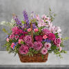 This lush lavender rose arrangement is a basket of beauty to brighten