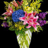 Celebrate love and grace with our exquisite arrangement featuring an enchanting mixture