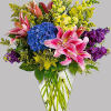 Celebrate love and grace with our exquisite arrangement featuring an enchanting mixture