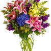 Celebrate love and grace with our exquisite arrangement featuring an enchanting mixture
