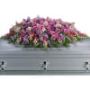 Like a heartfelt embrace, this beautiful casket spray delivers comfort and love