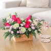 As beautiful as a summer sunset, this bright bouquet of roses and