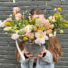 Stunning ceramic vase full of Tulips, Ranunculus, and other mixed flowers