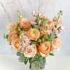 The Blushing Garden Delight is an exquisite arrangement that exudes romance and