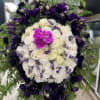Luscious English Garden Funeral Spray that includes dozens of roses, lisianthus and