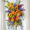 Vibrant colors in an easel spray to memorialize a vibrant life