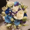 Beautiful unusual light and dark blue roses, white roses, alstroemeria, carnations and