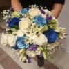 Beautiful unusual light and dark blue roses, white roses, alstroemeria, carnations and