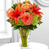The Vera Wang Dawning Delight Arrangement is an elegant mixture of peach