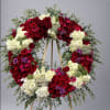 Honor the memory of a loved one with our Elegant Sympathy Flower