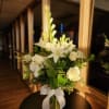 Express your deepest condolences with this bouquet of lilies, roses, gladiolus, and