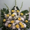 Arrangement with roses, mums, lillies, and gladiolus. 