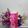 Box arrangement with roses, snapdragons, tulips, stock, and lisianthus. 