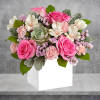 Capture their heart with the shimmering oasis arrangement, blooming for their special
