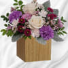 Swirling with flowers this sweet floral arrangement makes a marvelous gift filled