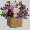 Swirling with flowers this sweet floral arrangement makes a marvelous gift filled