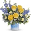 Escape to the seaside without leaving home! This radiant yellow rose arrangement