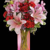 Make it a special day! This passionate bouquet of lovely lilies and
