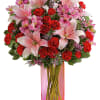 Make it a special day! This passionate bouquet of lovely lilies and