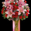 Make it a special day! This passionate bouquet of lovely lilies and