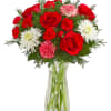 Give the gift of joy with our festive mix of blooms. This