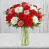 Give the gift of joy with our festive mix of blooms. This