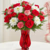 Give the gift of joy with our festive mix of blooms. This