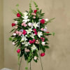 The &quot;Standing Spray with Lilies&quot; is a profound way to express your