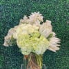 A luxurious oversized arrangement that will make a statement.  Textures of